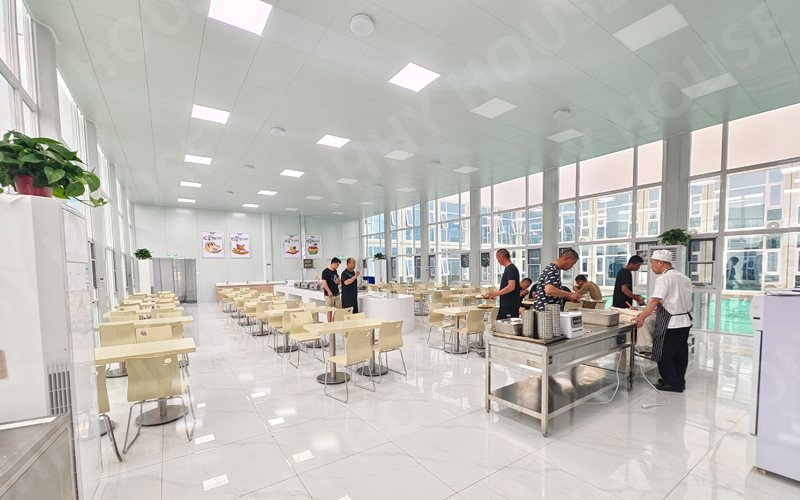 A luxury container cabin next to a simple container office